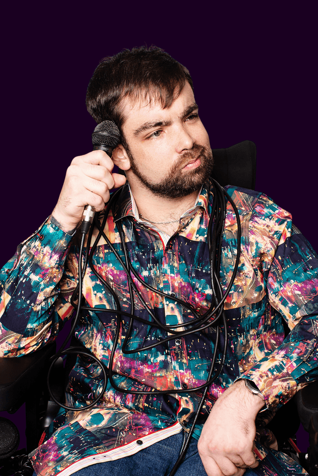 Josh Menchions with microphone